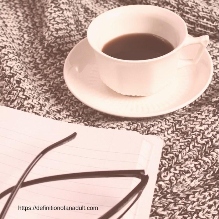 It's Difficult to Find Your First Job After College – Image Depicts a Tea Cup and Saucepan. the Edge of a Notebook, and Glasses