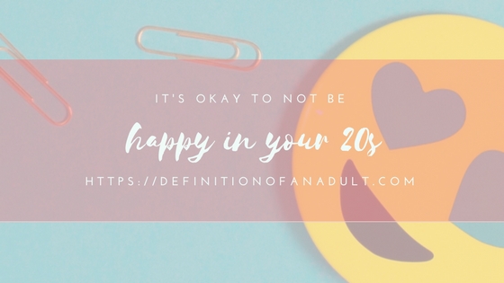 It's Okay to Not Be Happy in Your Twenties – Image has a smiley face and two paper clips